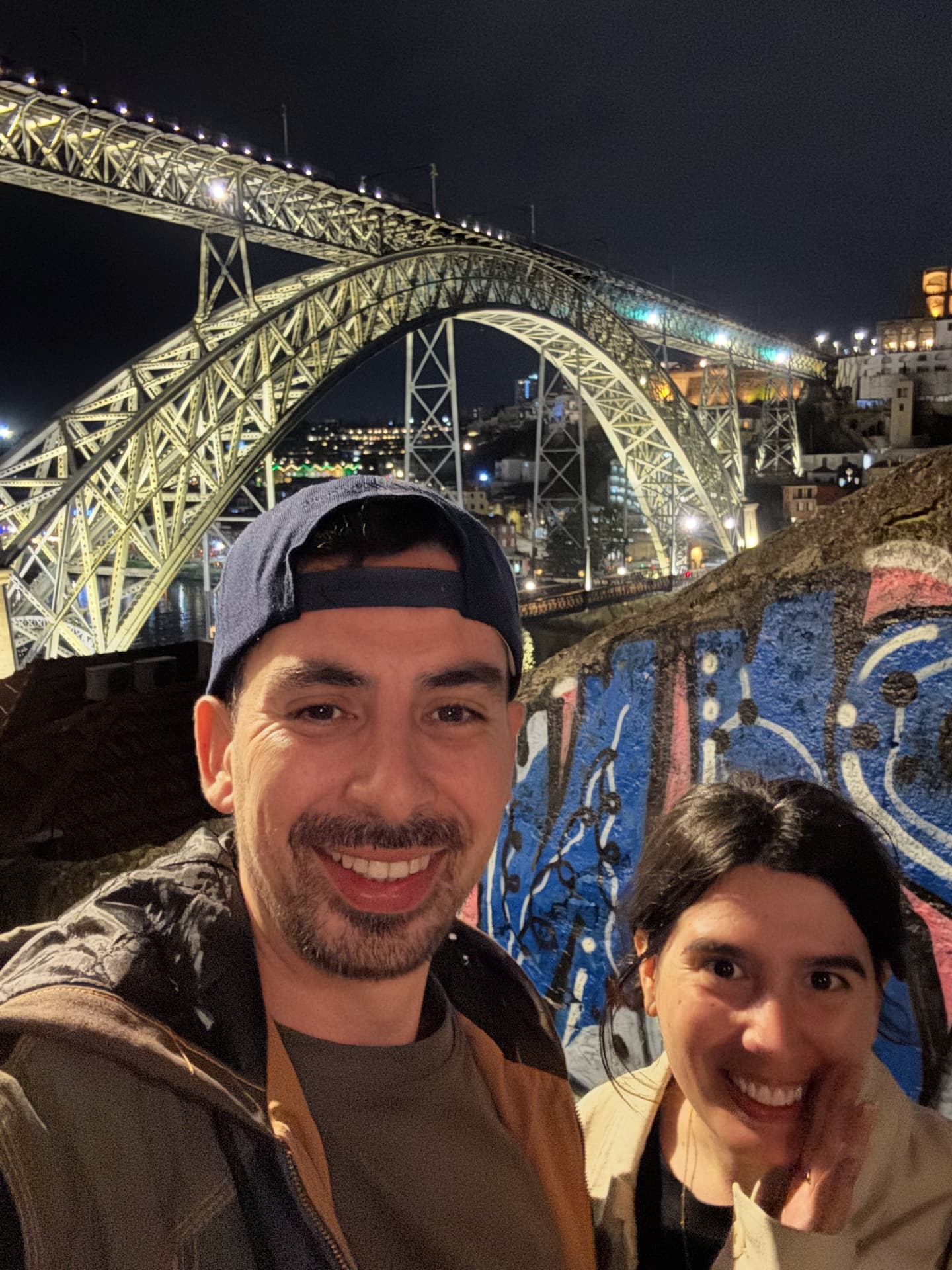 Porto by night with Dona Maria Pia Bridge in the background.