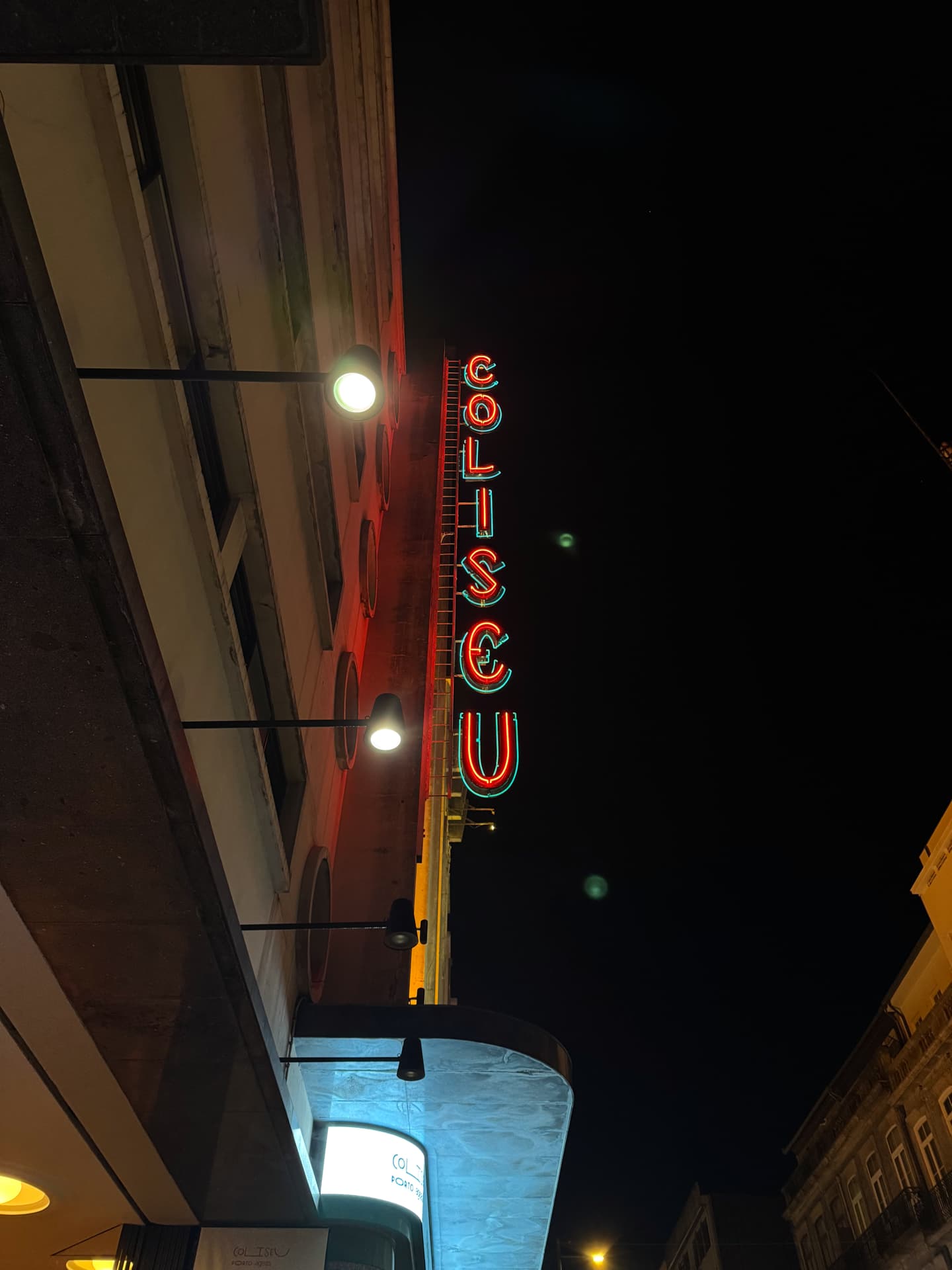 The neon sign of Coliseu do Porto at night.